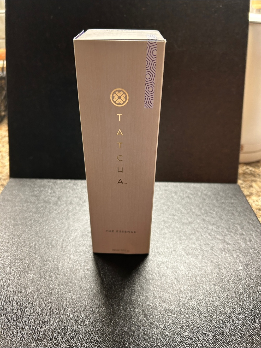Tatcha The Essence Hydrating Serum in Champagne and Purple Accents